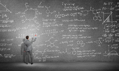 Student or teacher at blackboard