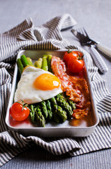 Green asparagus with fried eggs