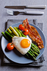 Green asparagus with fried eggs
