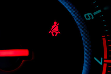seat belt icon on the dashboard of a car