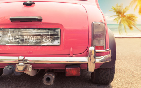 just married sign on classic vintage car. concept of love honeymoon in summer