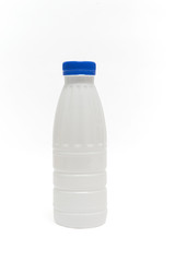milk plastic bottle isolated on black background