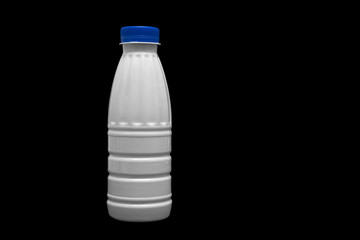 milk plastic bottle isolated on black background
