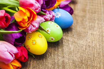 Colorful tulips with eggs on wooden. Happy easter. Spring time