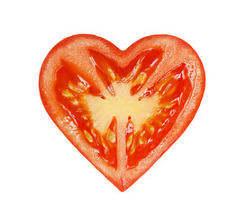 The half of the tomatoes in the form of heart isolated on a white