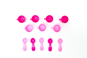 Collection of children's toys cups on white background