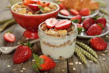 Natural yogurt with granola and strawberries
