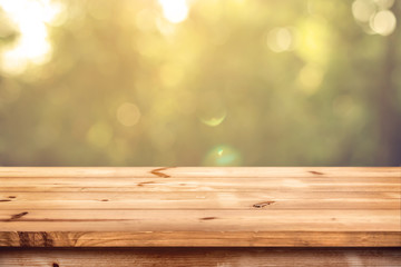 Top of wood table with blurred bokeh nature background - Empty ready for your product display montage.