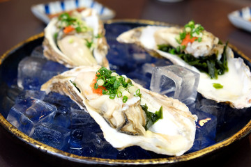 Fresh raw japan oyster with ponzu sauce