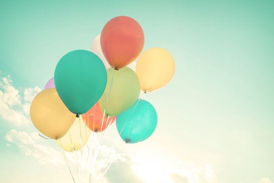 Colorful balloons in summer holidays. Pastel color filter