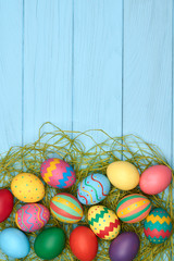 Easter eggs hand painted colorful, wood background