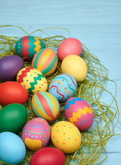 Easter eggs hand painted colorful, wood background