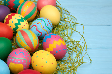 Easter eggs hand painted colorful, wood background