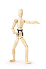 Karate man with black belt isolated over white background. Abstract image with a wooden puppet