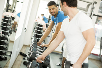 Young men training in the gym