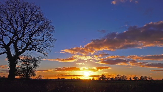 evening sunset over english countryside winter landscape timelapse - Staffordshire, England - February 2016