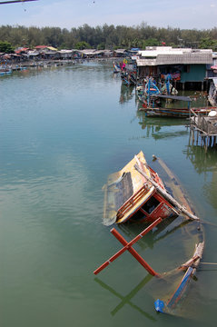 Abandoned sinked boat at river Thailand