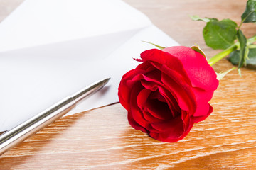 love letter envelope and red rose