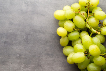 Grape cluster on the grey background.