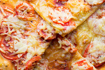 Pizza with ham, pepper and olives.