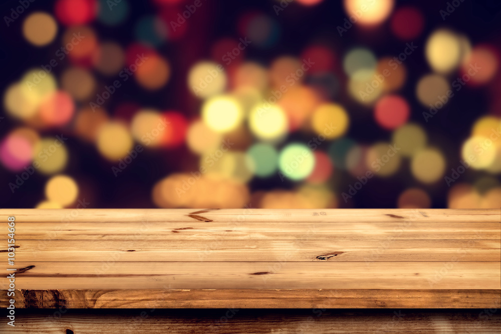Wall mural empty wooden table for product placement or montage with focus to the table top, blurred bokeh backg