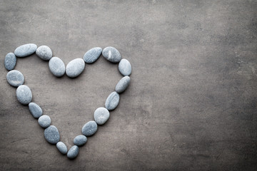Heart from the spa stones, on the grey  background.