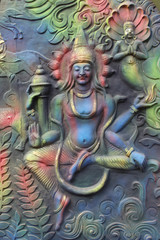 God of mythology sculpture on entrance.