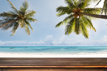 Top of wood table with blurred sea and coconut tree background - Empty ready for your product display montage. Concept of beach in summer