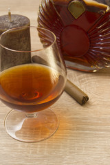 Cognac in glass and cigar