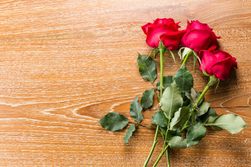Fototapeta premium red rose on wooden background