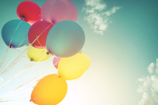 Fototapeta Multicolor balloons in summer holidays. Pastel color filter