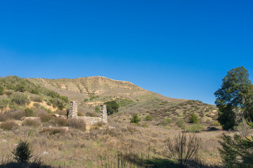 Fototapeta na wymiar Ruins of Homestead in Hills