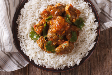 beef madras with basmati rice close-up on a plate. horizontal top view
