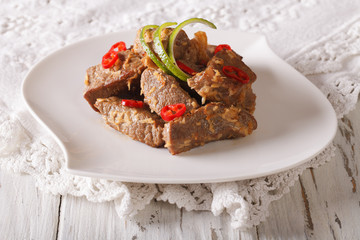Rendang beef with spices close-up on the table. horizontal
