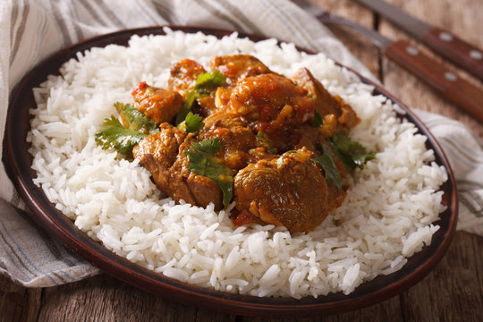 madras beef with garnish basmati rice close-up on a plate. horizontal
