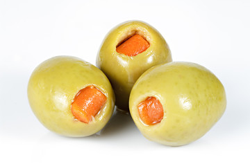 Green olives stuffed with red paprika isolated on white