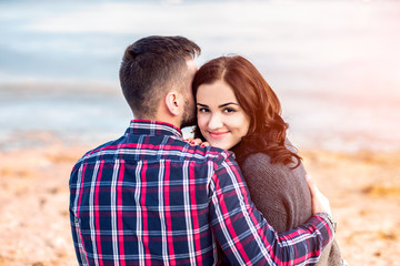 Young happy couple outdoor on the beach