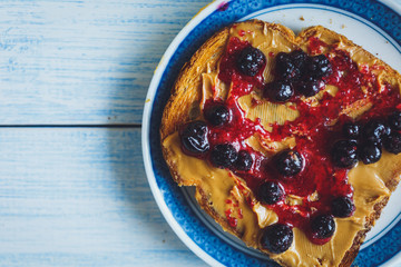 Sandwich with peanut butter and black currant jam