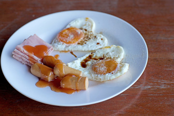 breakfast meal with sausage ham egg