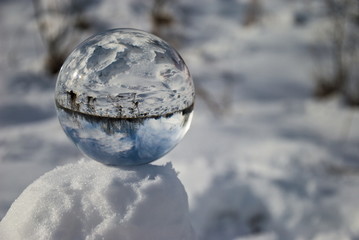 Beautiful crystal ball in snow at winter