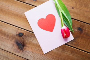 close up of flowers and greeting card with heart