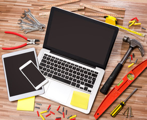 Wood handyman's desk in high definition with laptop, tablet and