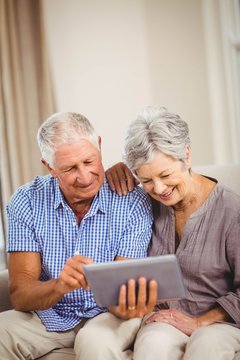 Senior Couple Looking At Digital Tablet