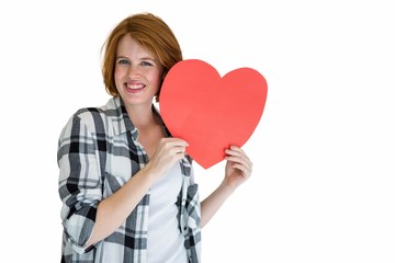 Fashion hipster holding a red heart shape