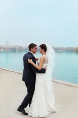 Gentle embrace bride and groom