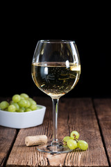 Old wooden table with White Wine