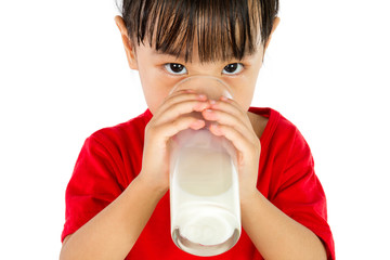 Asian Little Chinese Girl Drinking a cup of Milk