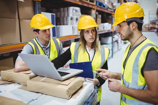 Portrait Of Smiling Warehouse Managers