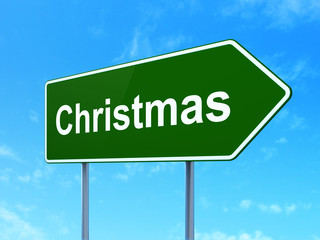 Holiday concept: Christmas on road sign background