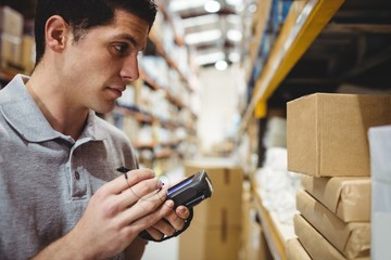 Warehouse worker scanning box